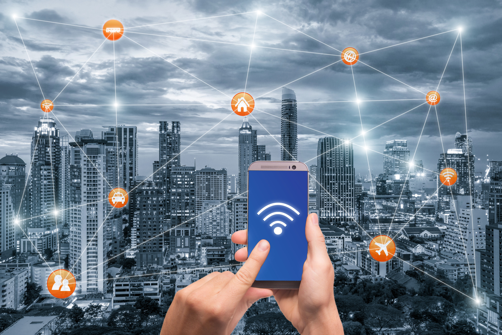 Hand holding smartphone with bangkok city scape and wifi network connection. Smart city network connection concept
